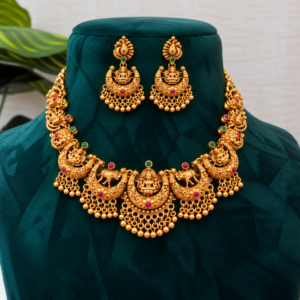 antique gold temple jewelry on teal velvet