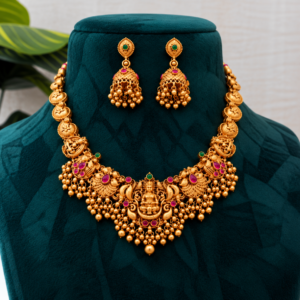 temple gold jewelry on teal velvet